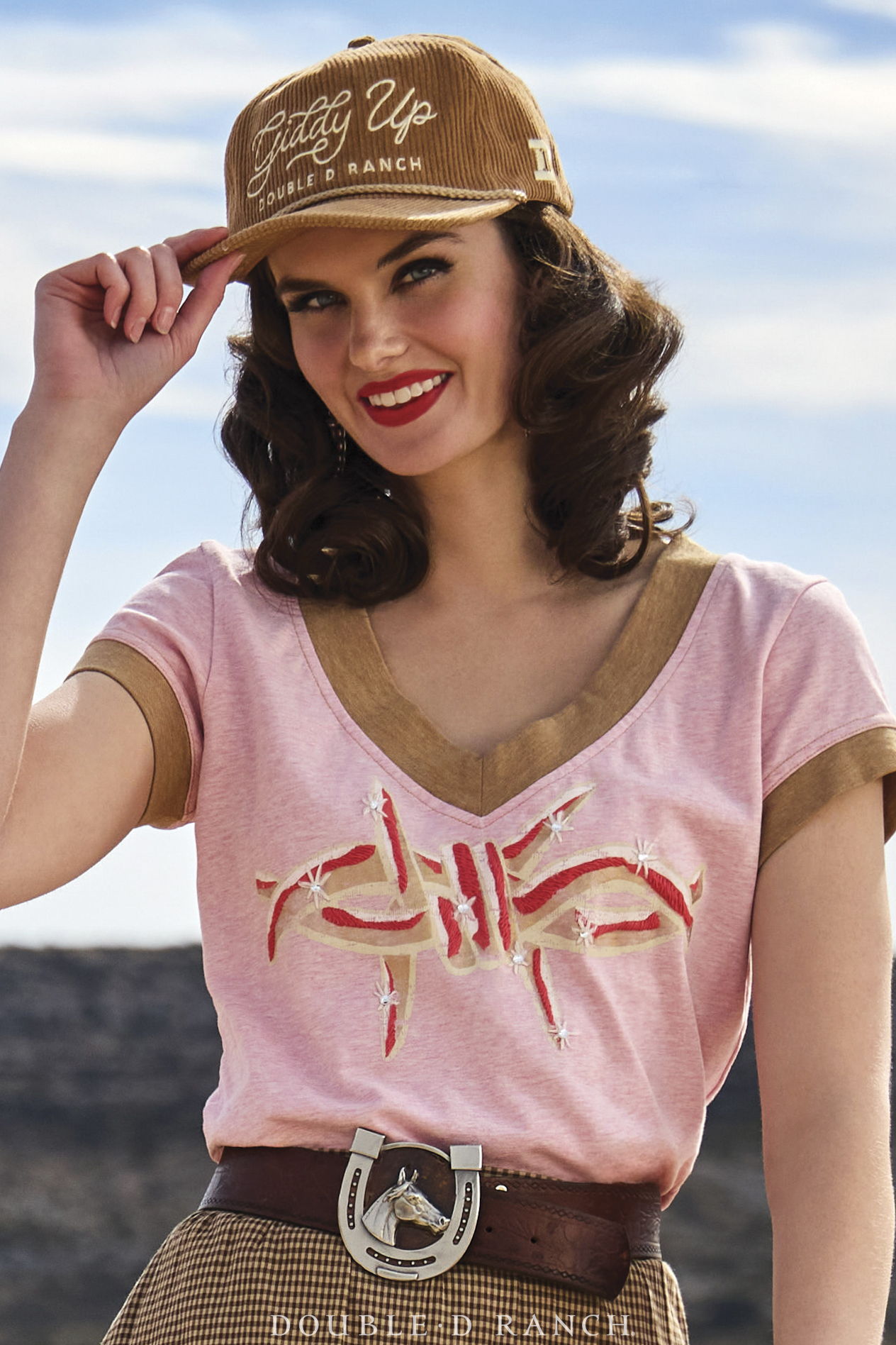 Kaylin wearing the Razor Sharp Tee from the Rhinestone Suits and Cowboy Boots Collection.