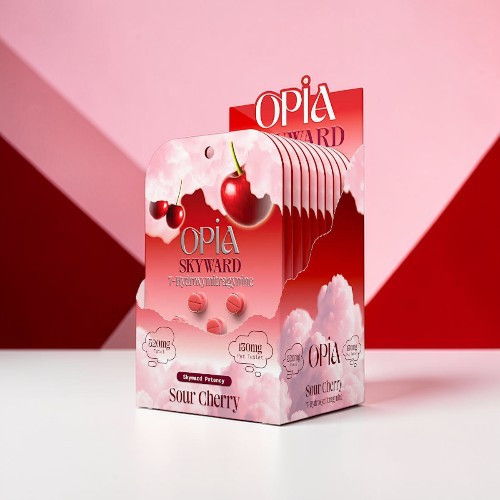Packaging of Opia Skyward skincare product with cherry design on pink background.