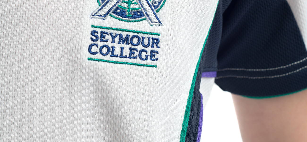 Custom VS Mesh short sleeve tee with feature panels, piping and embroidery for Seymour College