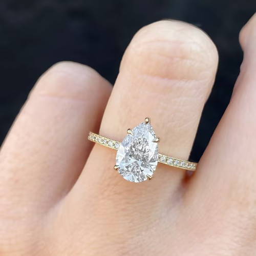 pear cut diamond ring on hand