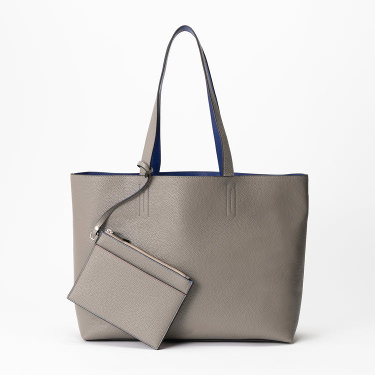 Gray tote bag with blue interior and a matching pouch attached.