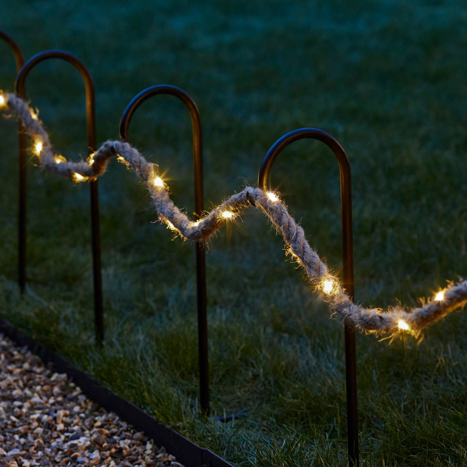 Rope micro light decoration illuminated along garden path