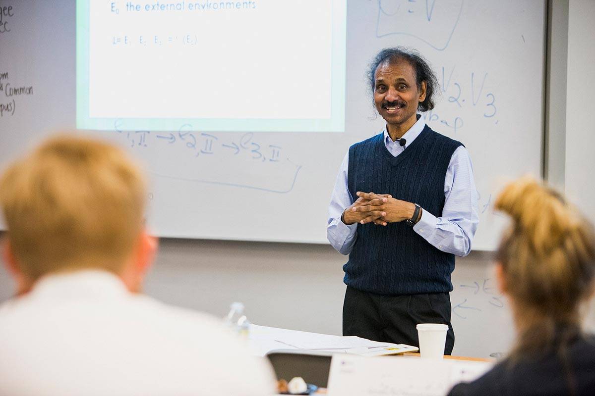 Kabi teaching at front of class