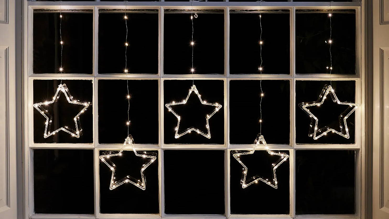 Osby star curtain light illuminated in window