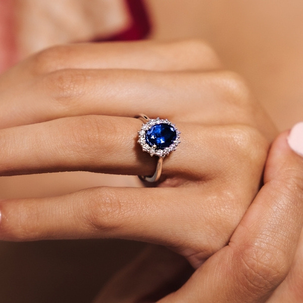 Floral diamond halo engagement ring with 2ct oval cut lab grown blue sapphire