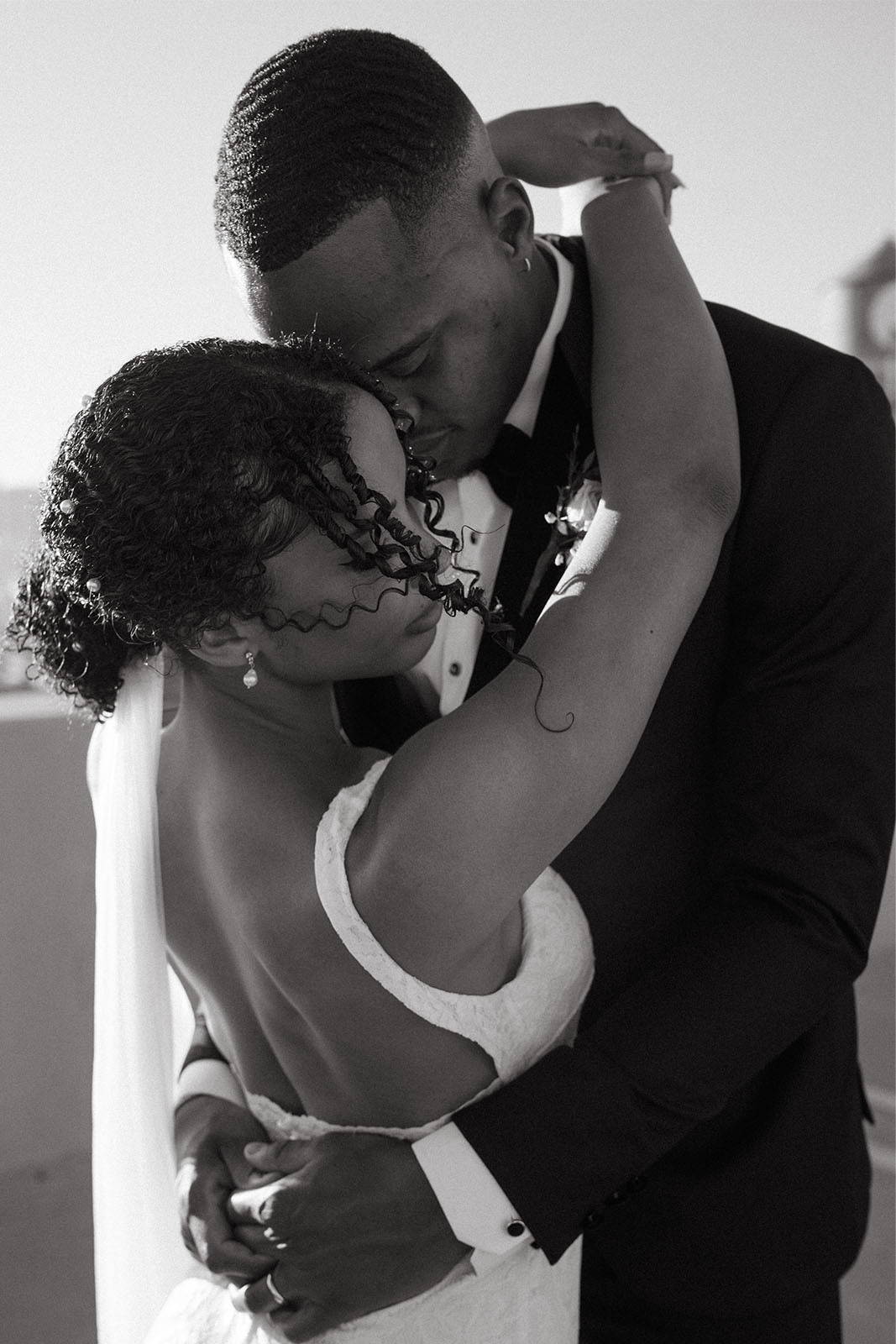 Bride and groom holding each other