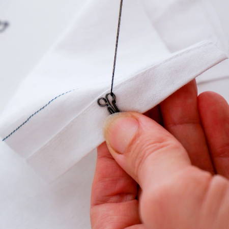 Sew a hook and eye closure with a hand stitch