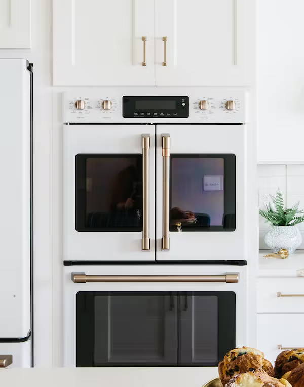 matte white french door double wall oven with white cabinets