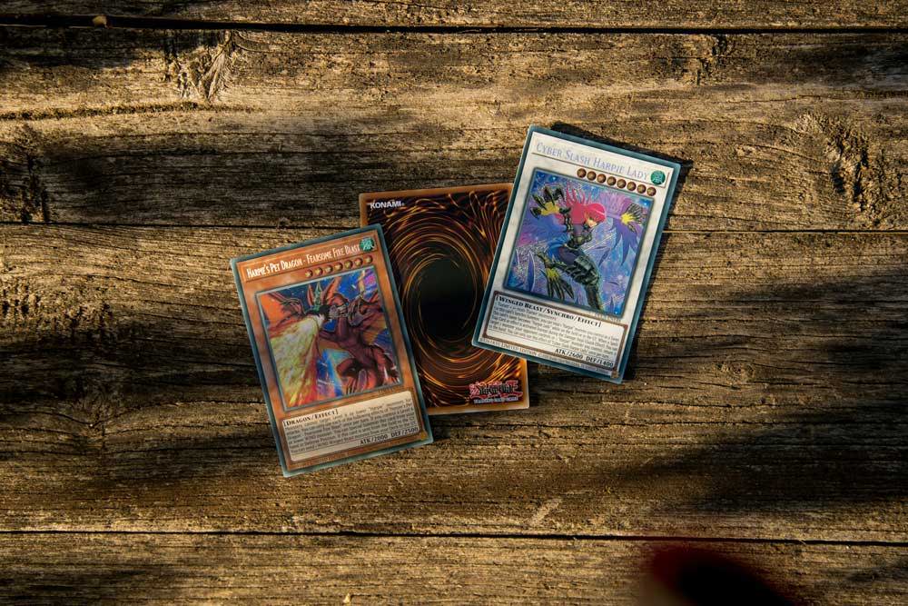 tcg cards on top of a wooden table