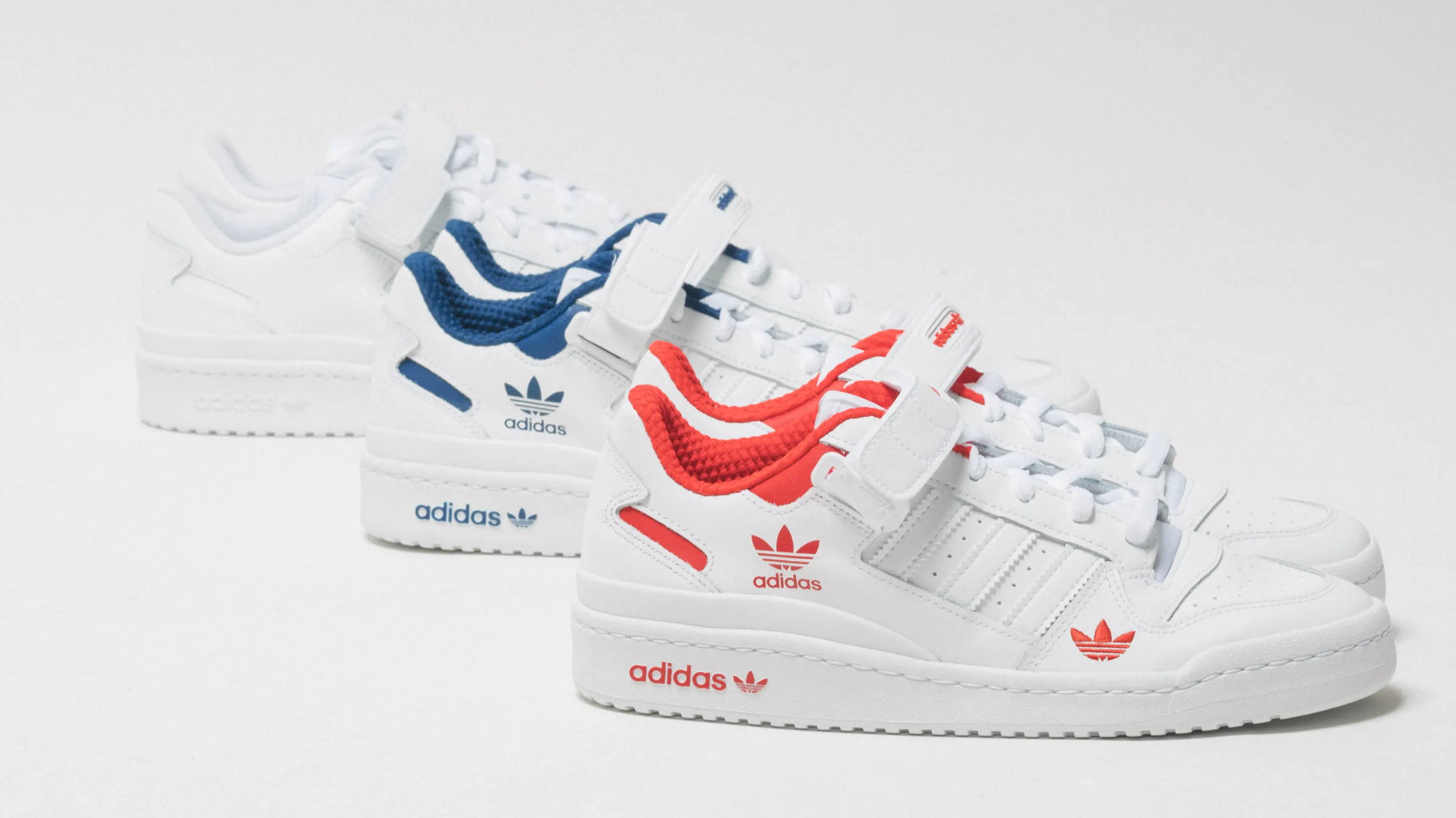 white, blue, and red colorways of adidas forum