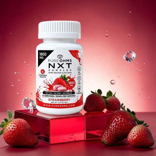 Bottle of strawberry-flavored supplement with fresh strawberries on a red background.