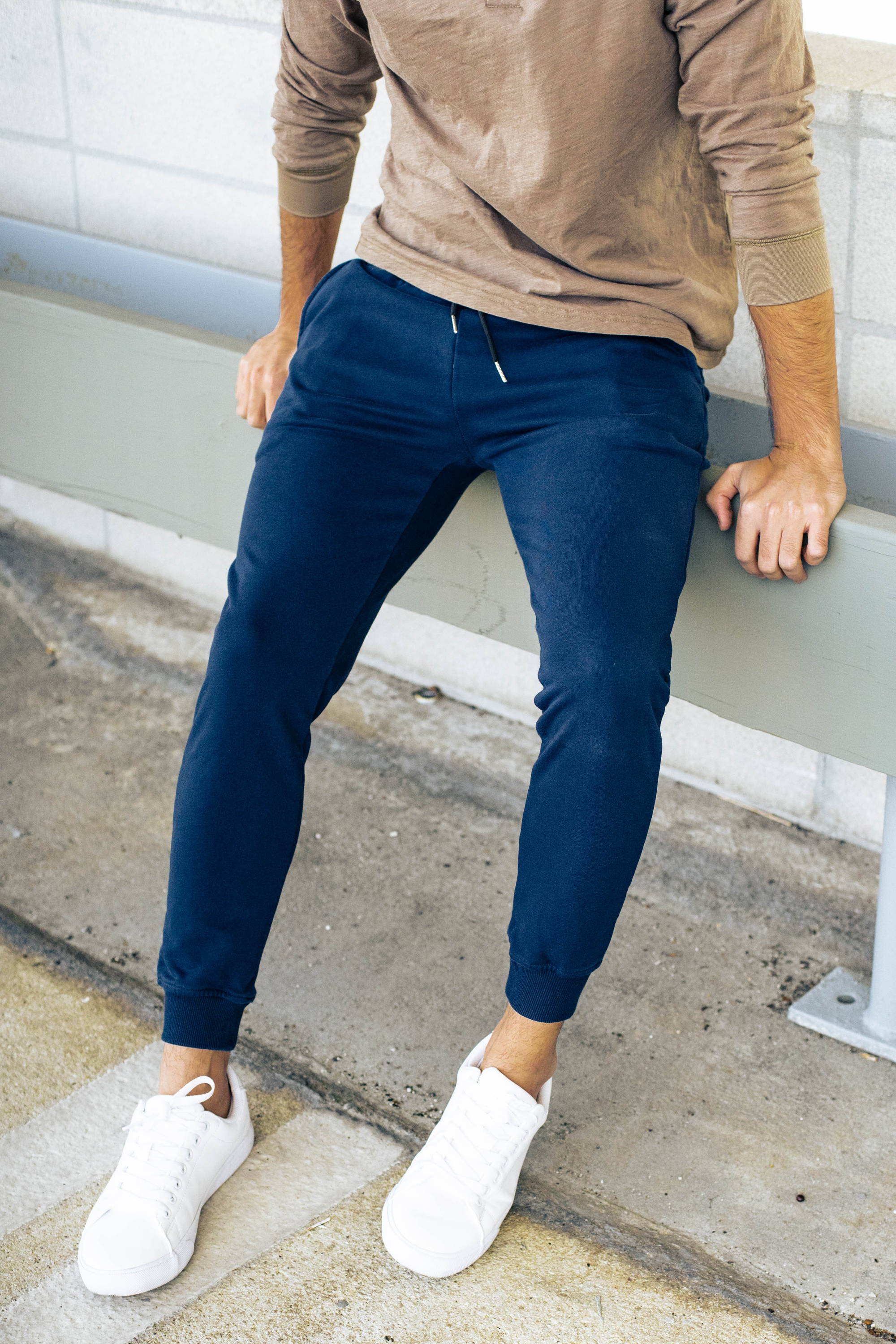 Man sitting wearing blue mens joggers 26'' inseam from under510.com