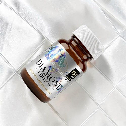 Brown bottle of Diamond Edition supplement on a white surface.