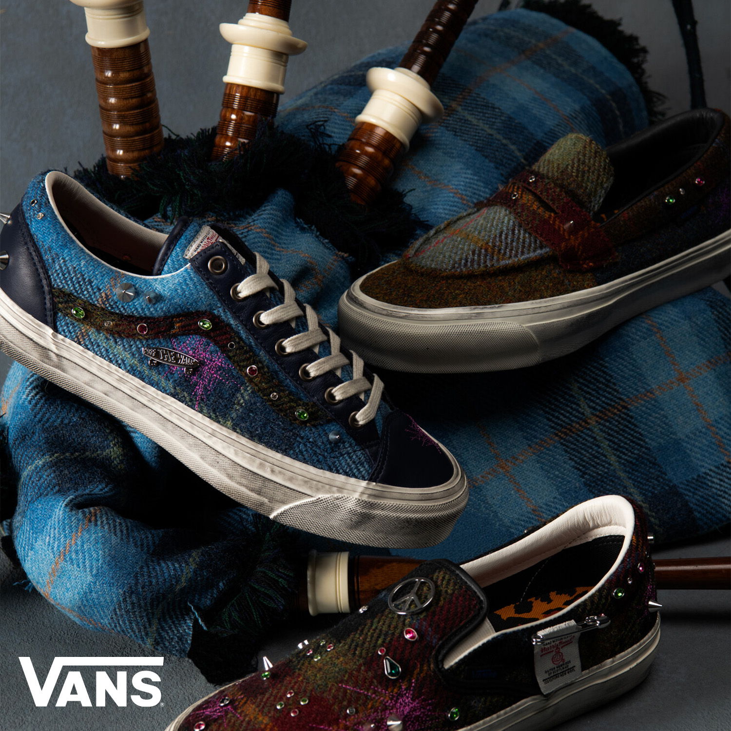 Vans shoes displayed with traditional Scottish bagpipes and tartan fabric.