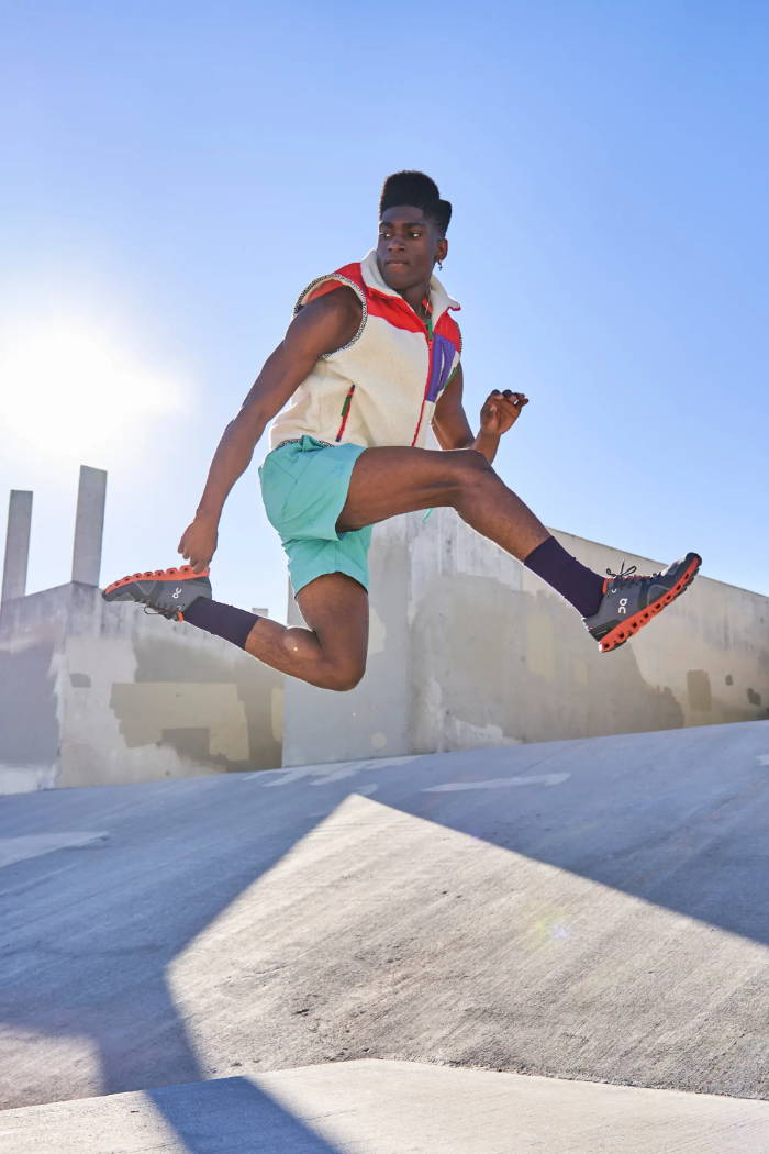male model wearing on running shoes jumping