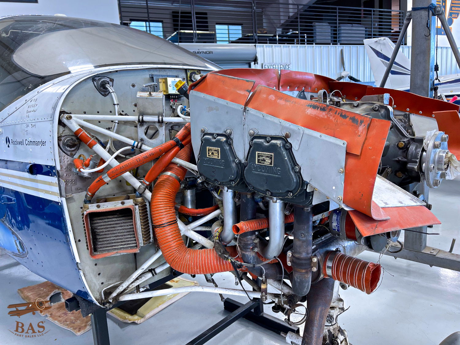 Aircraft engine compartment showing detailed components and assembly.