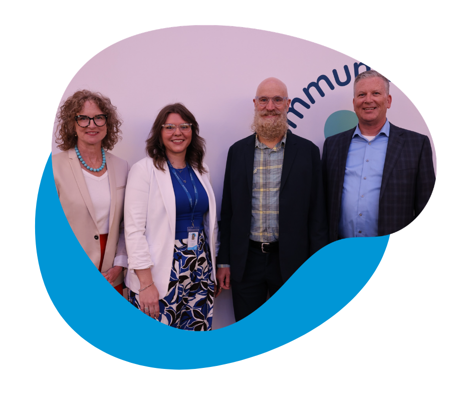 Kate Dunning, Jordan Miller, Matt Dunning, and Marty Gallagher smiling in front of white backdrop.