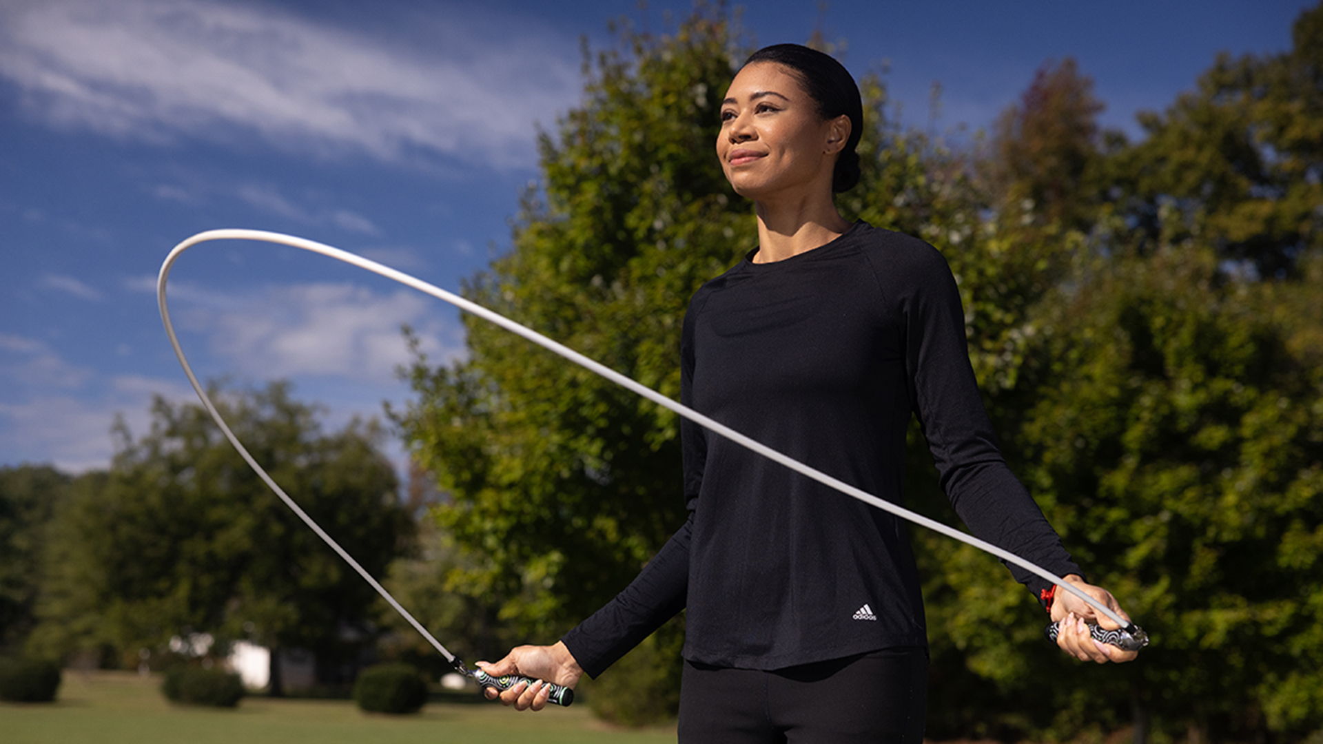 Woman jumping rope outdoors