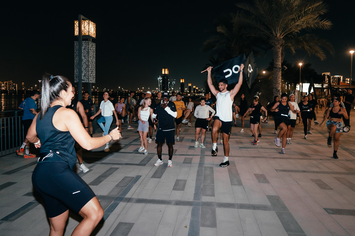 FRAME RUN CLUB runners warming up before the 5K social run