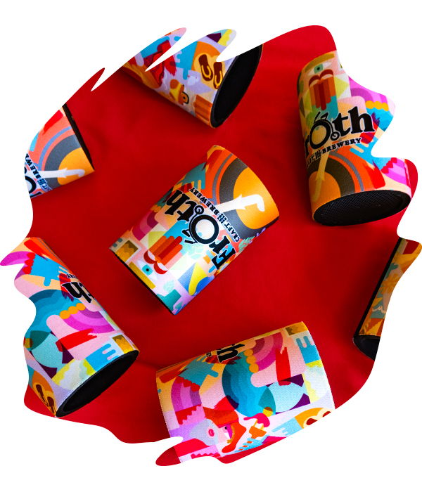 Overhead view of vibrant full-colour sublimation printed stubby holders for Froth Brewing scattered on a red surface