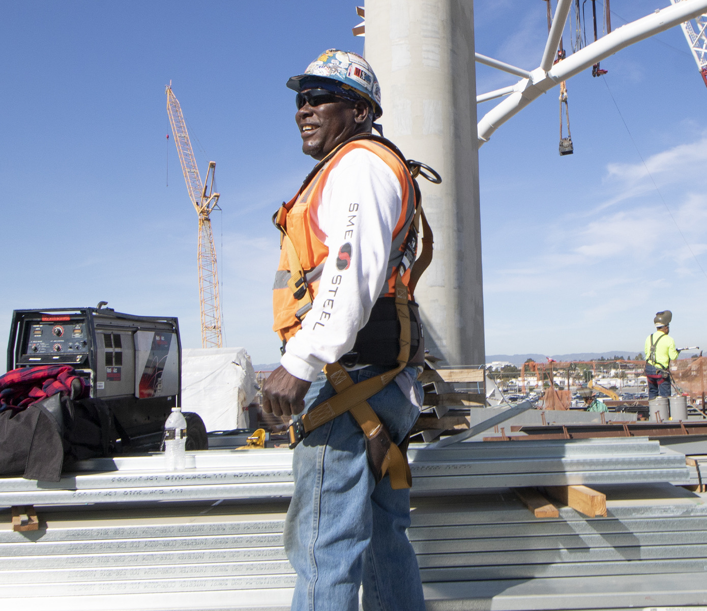 Construction professional workers wear safety harnesses and safety
