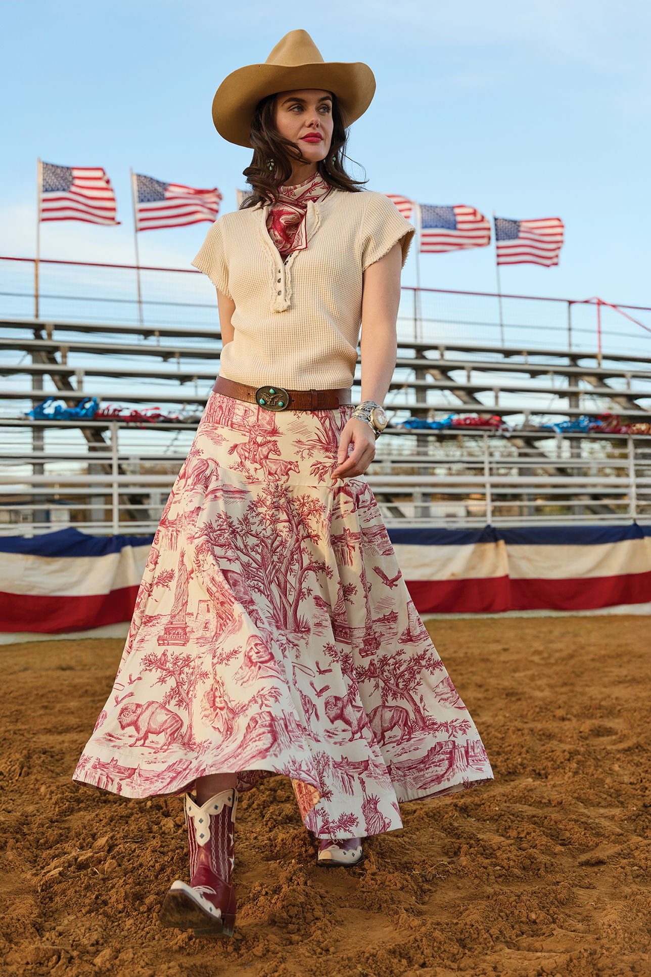 Kaylin wearing the Addie Henley Top with the America the Beautiful Toile Skirt paired with the Star Spangle Boot and Double D Ranch Jewelry and Accessories.