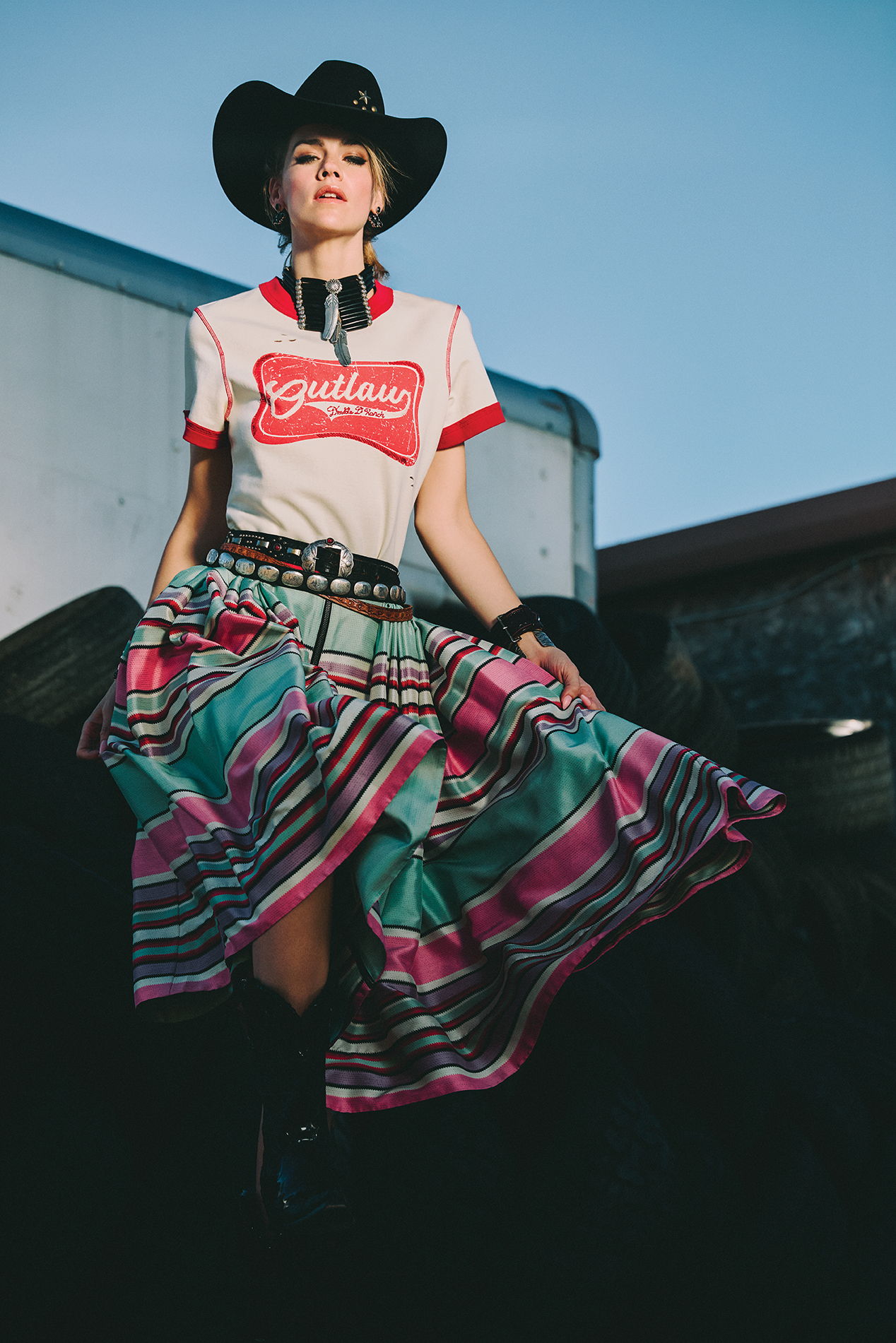 Lozzie wearing the Wanted Cowgirl Top and the Round Top Serape Skirt with Double D Ranch jewelry and accessories.