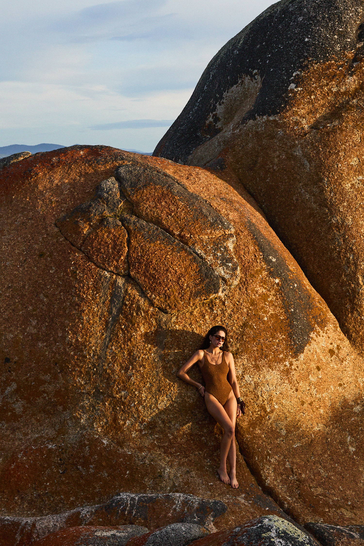 THE UPSIDE new swim. Shop now. Model wears the brown tobacco Sands Claudina One Piece.