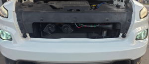 2016 Jeep Cherokee with HornBlasters Sniper Electric Horn behind the grille