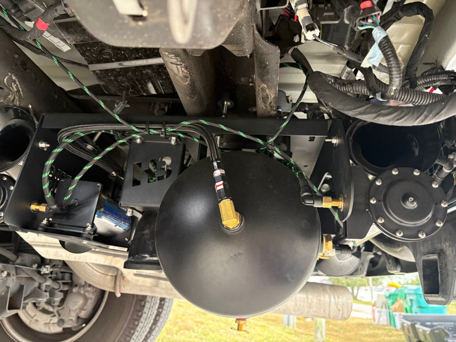 Wide shot of finished Stealth 5 Gallon Spare Tire Delete kit install on Shawn's 2025 Chevy Silverado 3500HD High Country dually HornBlasters gallery photo 3