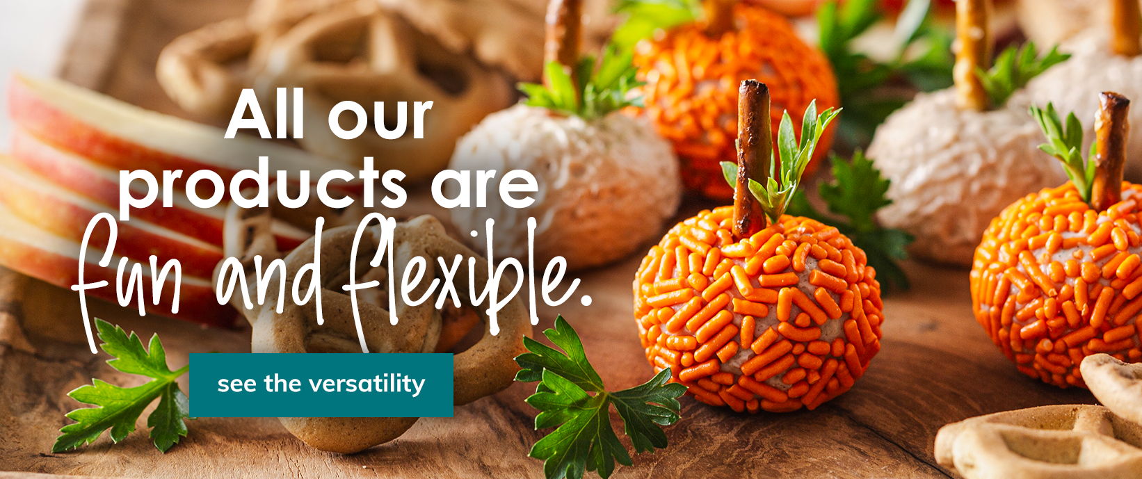 Pumpkin-shaped treats and apple slices with the text “All our products are fun and flexible” and a “See the versatility” button.
