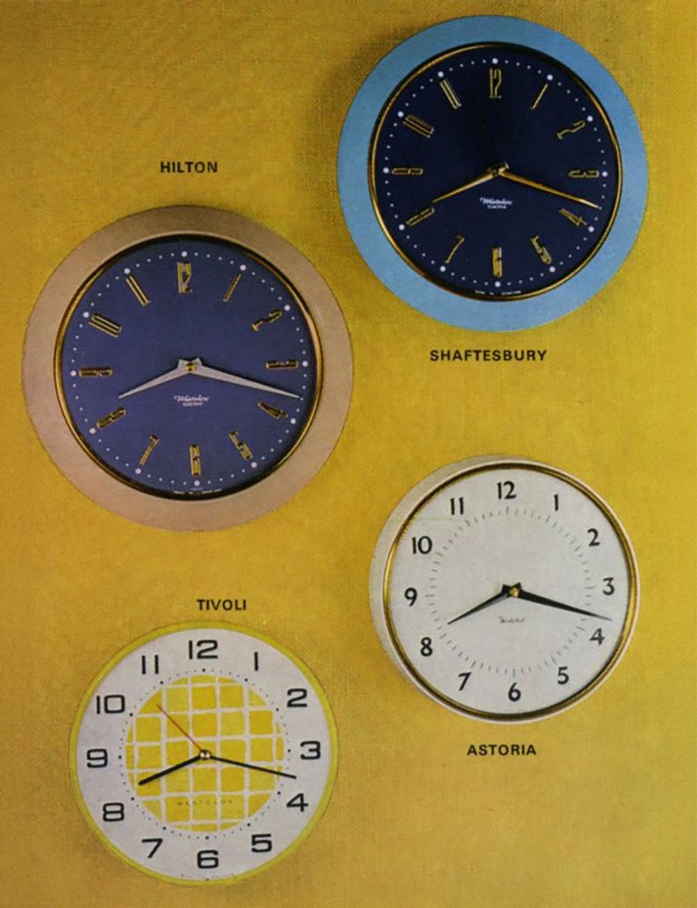 Four decorative wall clocks on a yellow background.