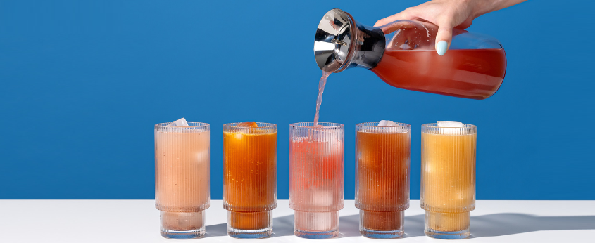Pouring Blueshift drinks into glasses