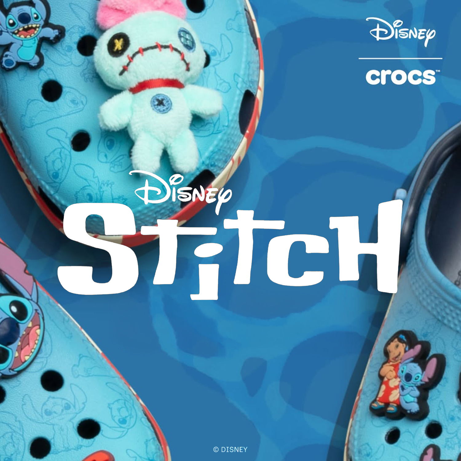Disney Stitch-themed Crocs with plush characters on a blue background.