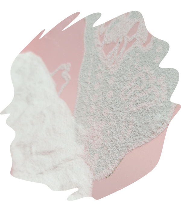 Layers of white thermo-adhesive powder being applied over freshly printed DTF transfers on film