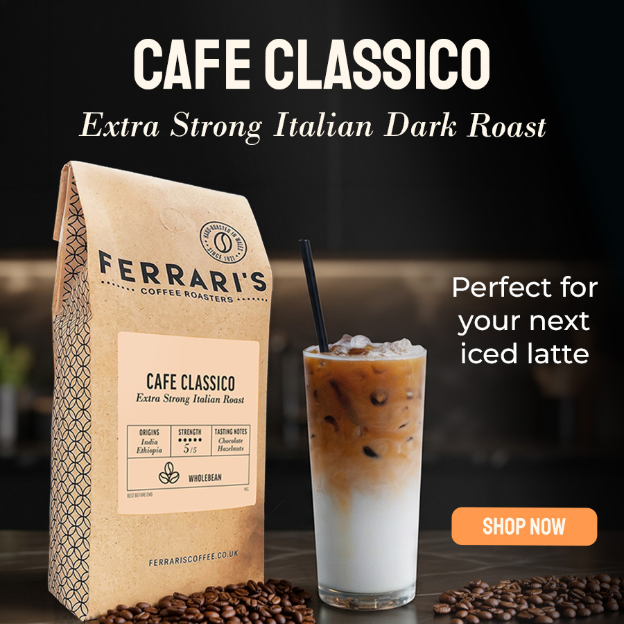 Ferrari’s Café Classico extra-strong Italian dark roast coffee beans with a refreshing iced latte on a black marble counter