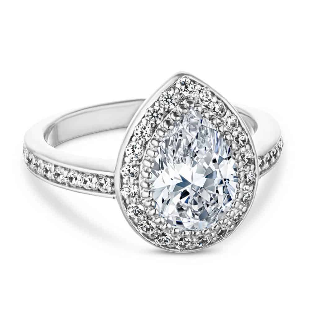 french engagement ring Shown with a 1.0ct Pear cut Lab-Grown Diamond with a diamond accented halo and band in recycled 14K white gold