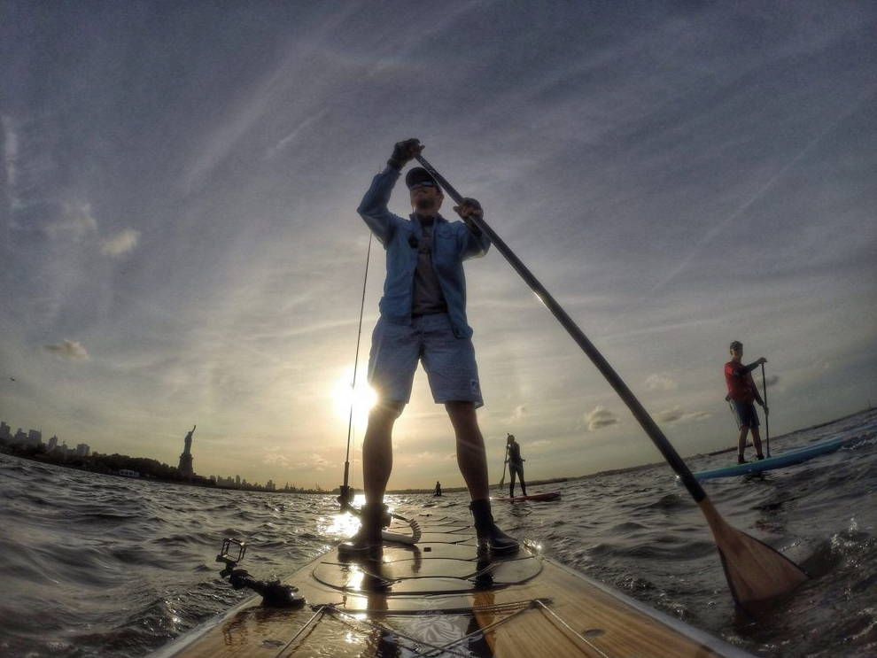 Sean Callinan on a sup fly fishing in New York 