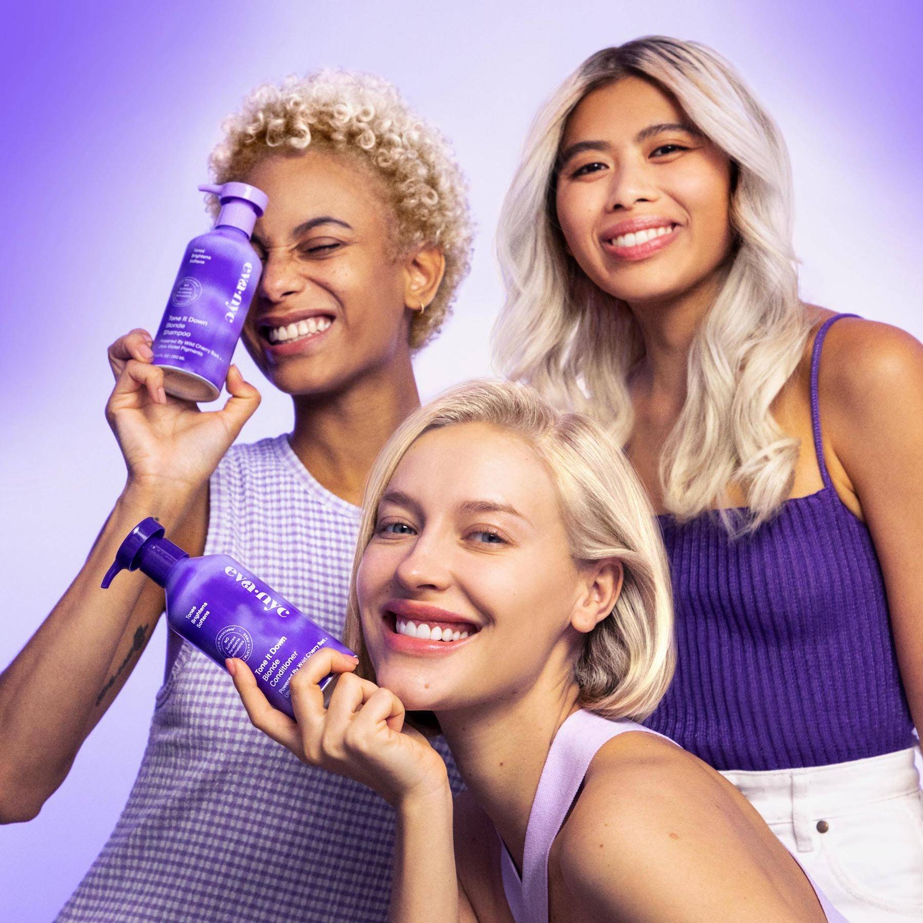 Models holding Eva NYC's Blonde Shampoo and Conditioner