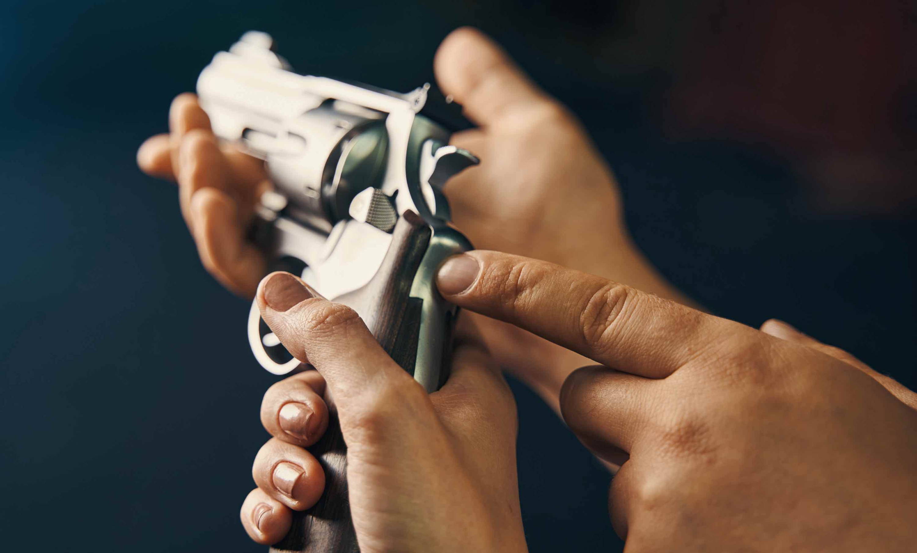 female learning to handle a gun