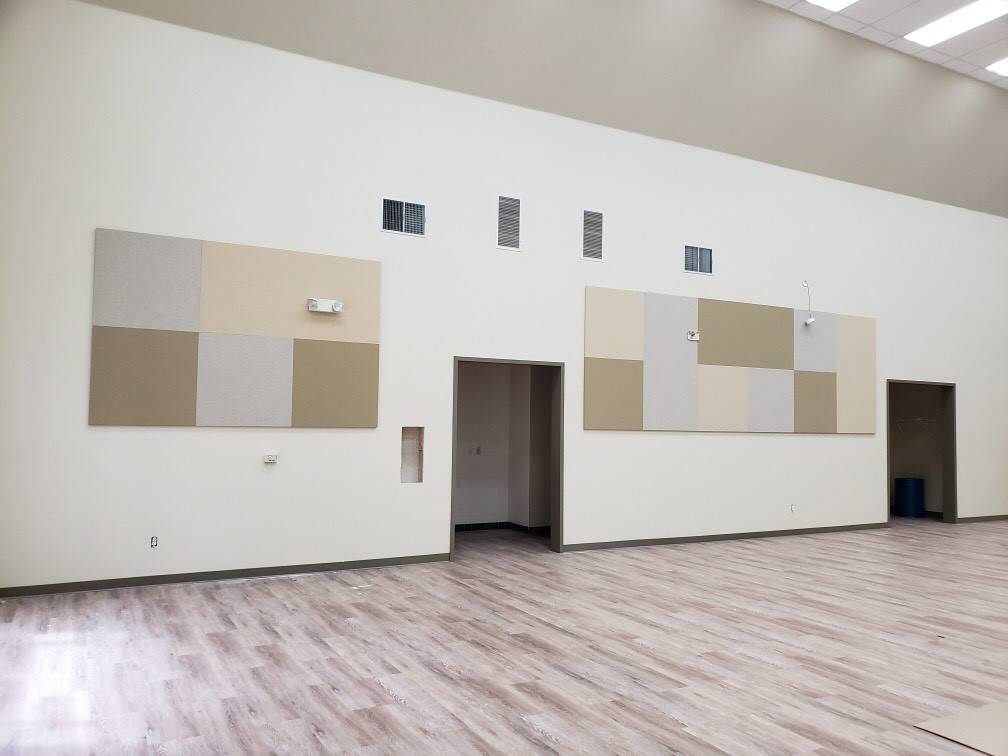 acoustic panels reduce echoes in a large room