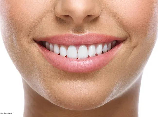 Girl smiling with pearly white teeth