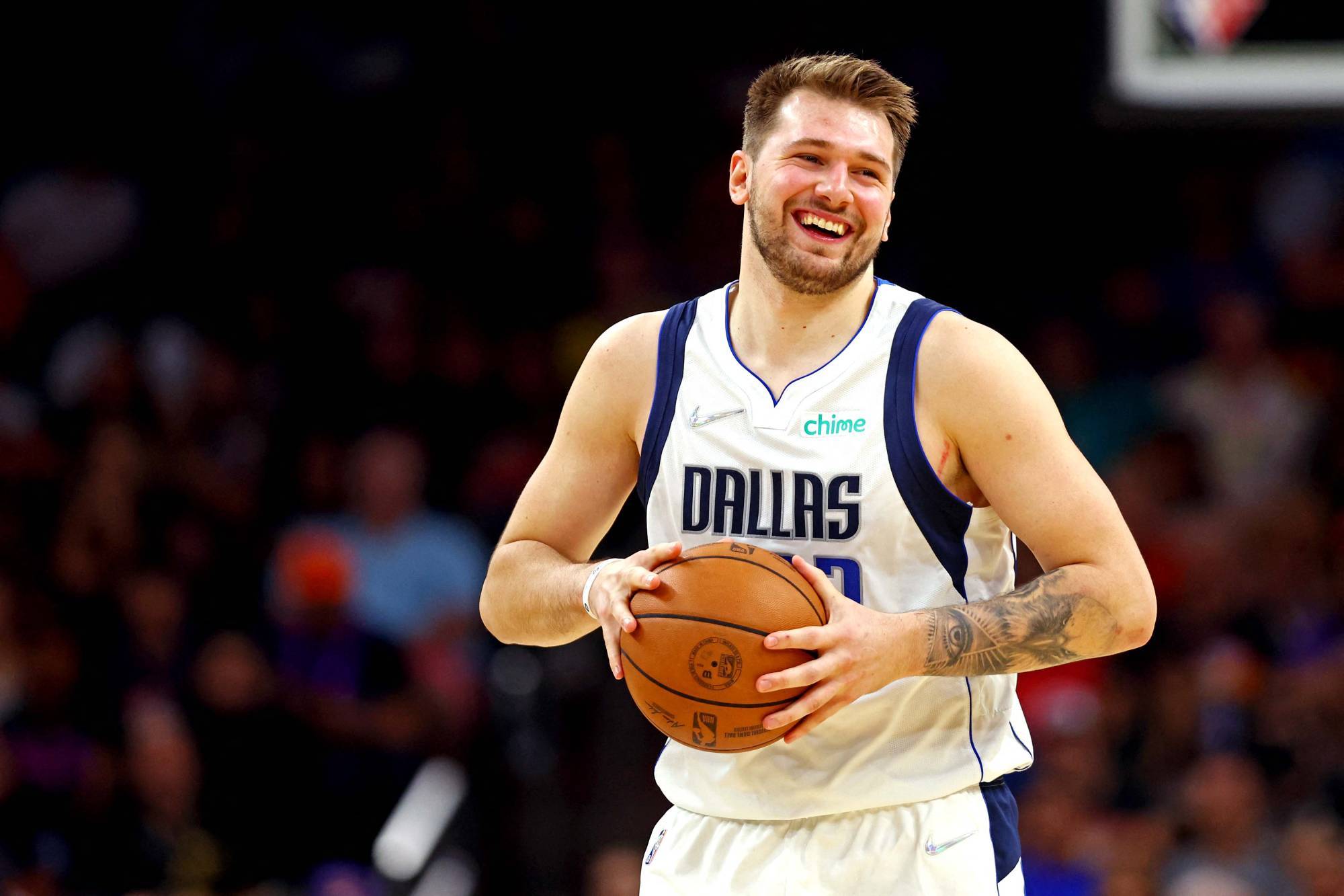 luka doncic grabbing a basketball