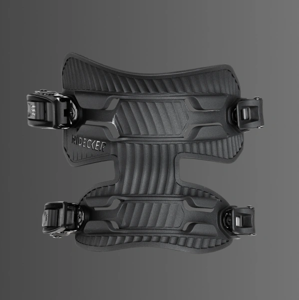 Black snowboard binding viewed from above on a gray background.