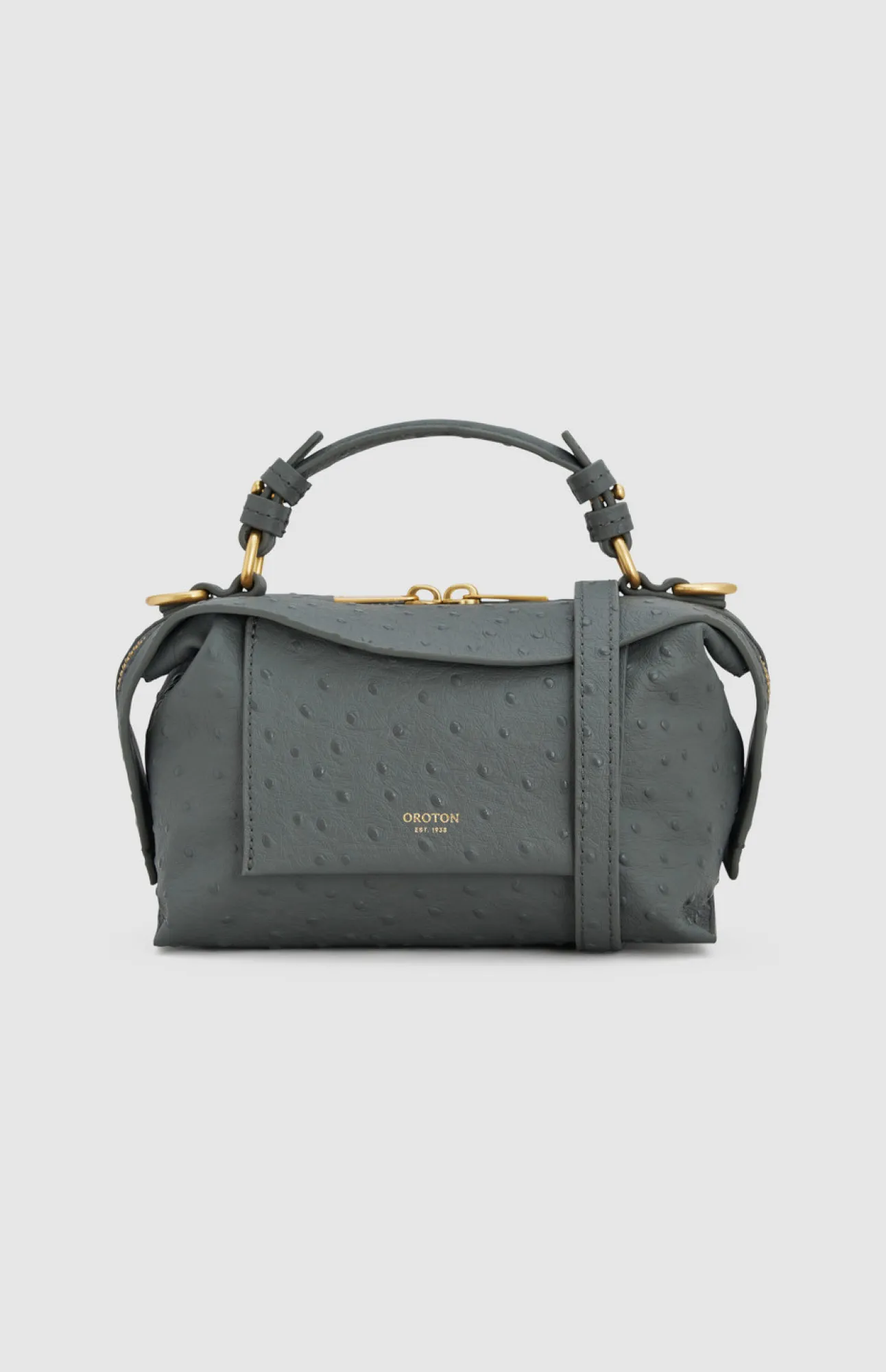 Gray handbag with a top handle and shoulder strap.