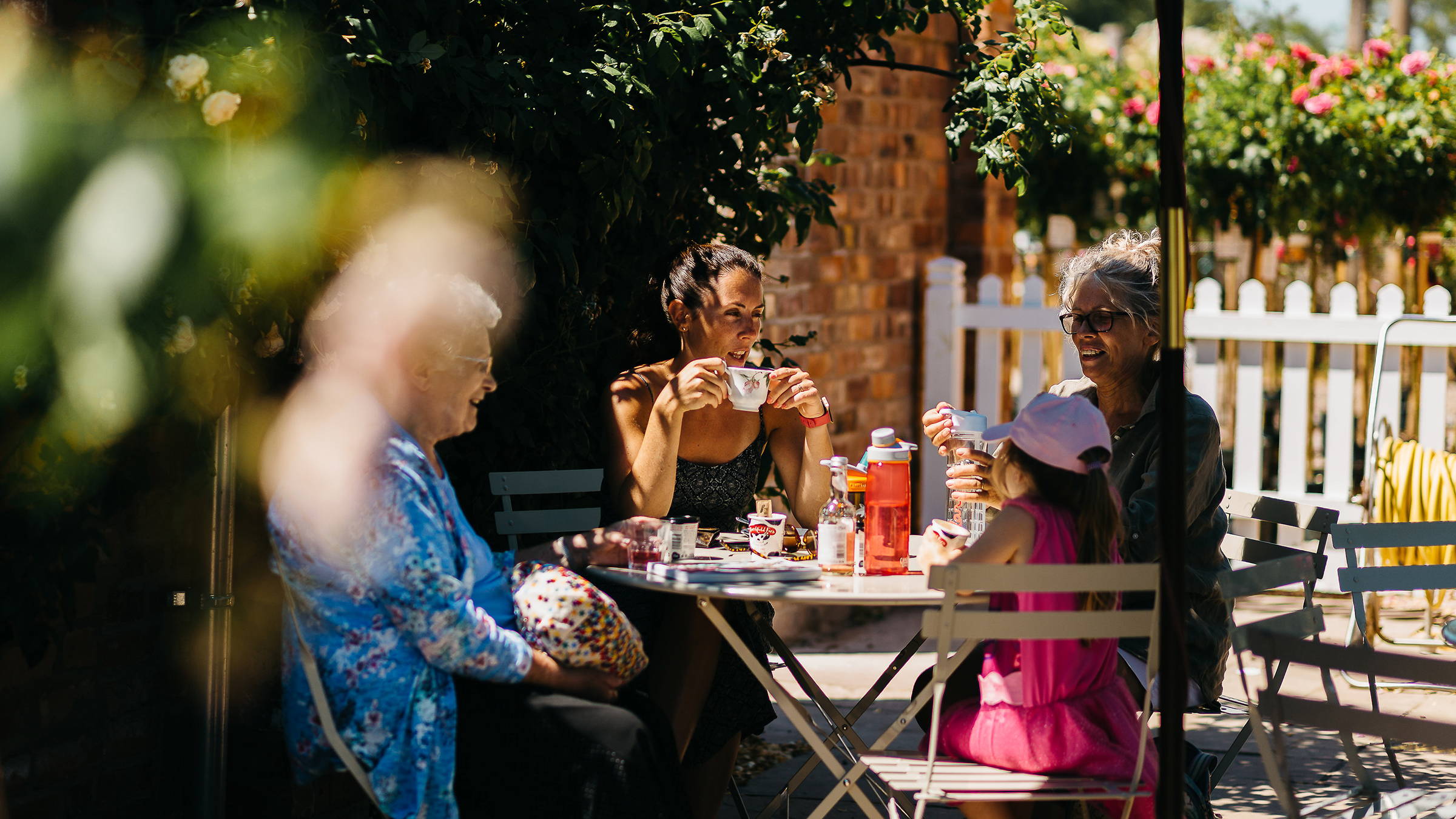 A family sitting at a table outside the Garden Tea Room