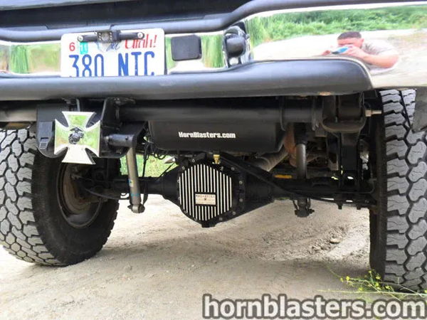 Rear undercarriage view showing the black air tank and mounted horn system on Dean's 2005 Chevy Silverado 2500 HD, install photo 4