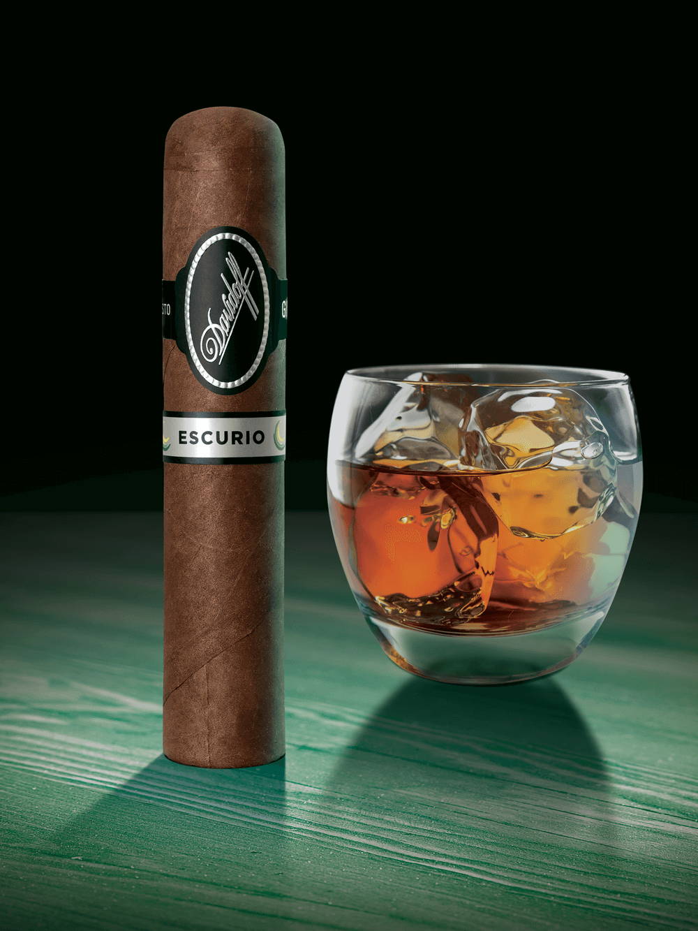 A Davidoff Escurio cigar standing upright next to an alcoholic beverage.