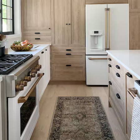 Cafe matte white appliances with Brushed Brass hardware in kitchen with Semihandmade cabinets
