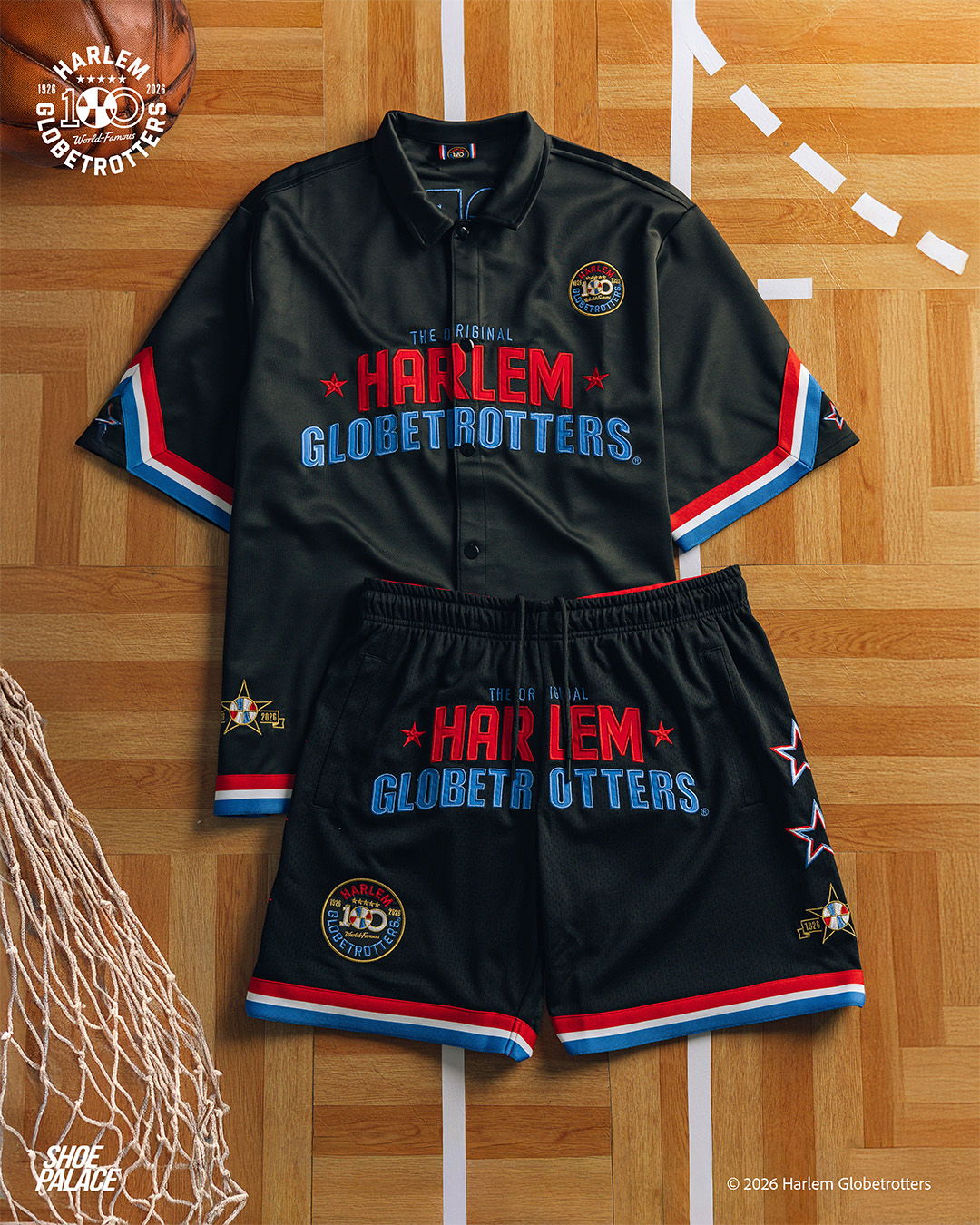 Harlem Globetrotters basketball jersey and shorts on wooden floor.